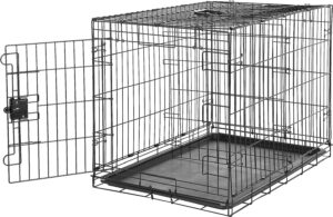 Metal dog crate with tray for pet training.