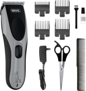 Hair clipper set with attachments and grooming accessories.